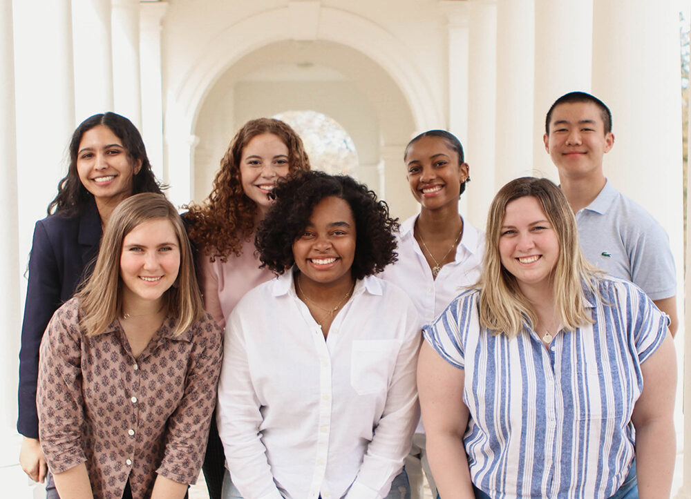 Seven UVA students who produce the Still We Rise podcast in a group photo