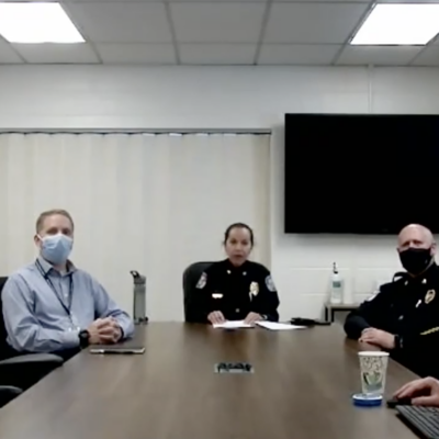 Charlottesville Police Chief RaShall Brackney sits with Major Jim Mooney and Sergeant Greg Wade at a table during Friday’s virtual press conference