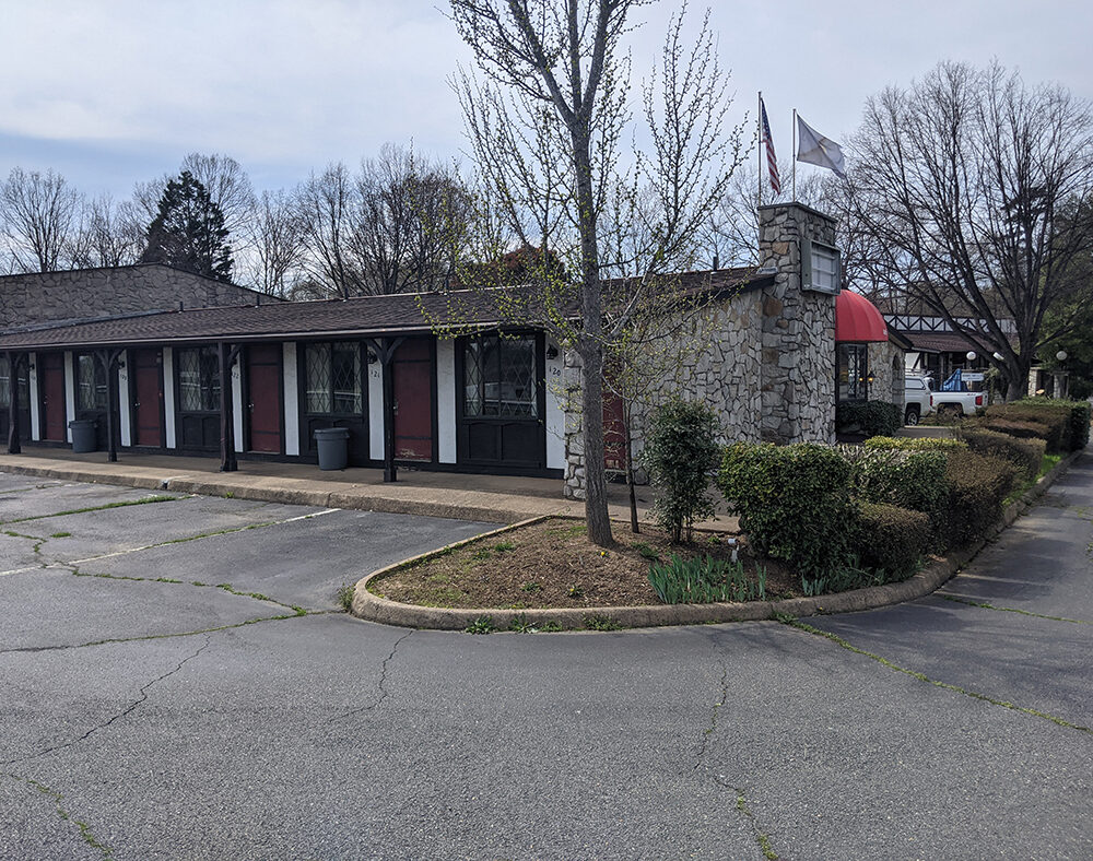 Brick exterior of the Red Carpet Inn