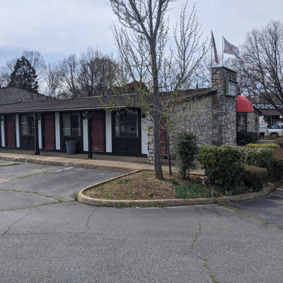 Brick exterior of the Red Carpet Inn