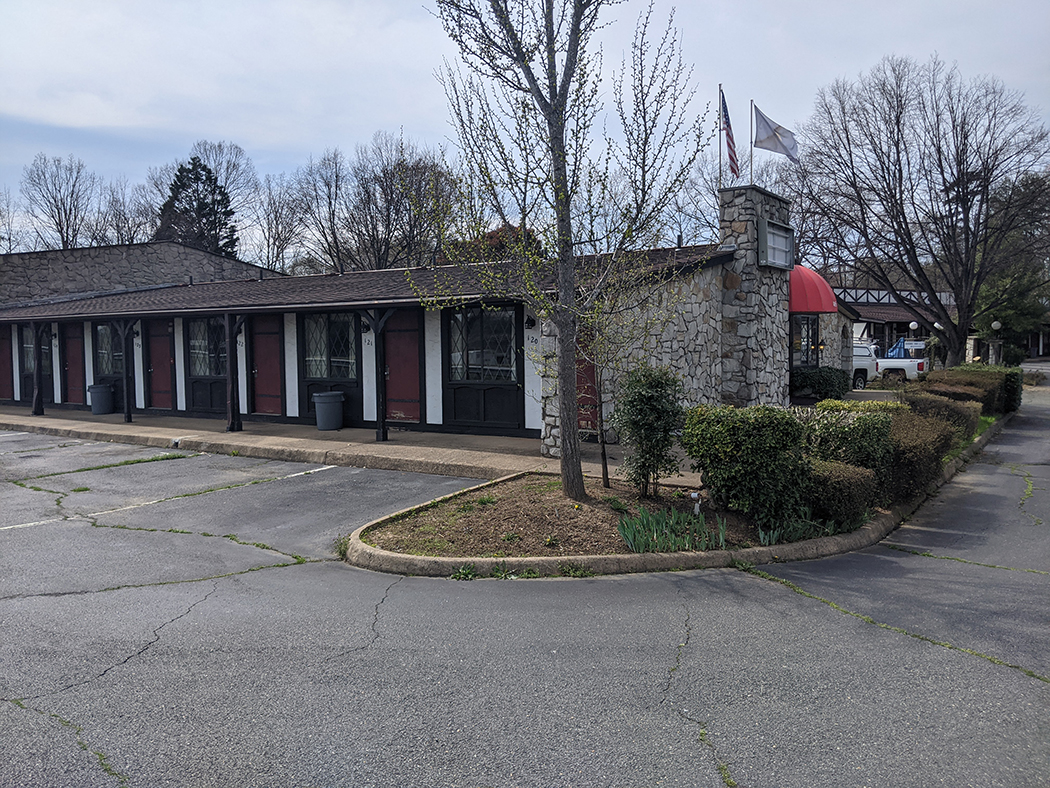 Brick exterior of the Red Carpet Inn