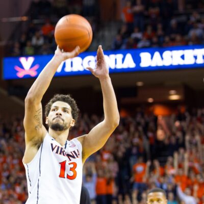 Anthony Gill has basketball in his hand and is about to take a shot