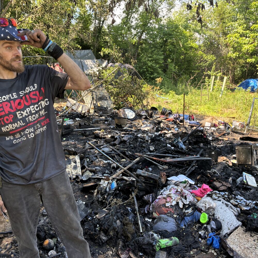 A fire at the Rivanna Trail encampment costs one man his shelter 
